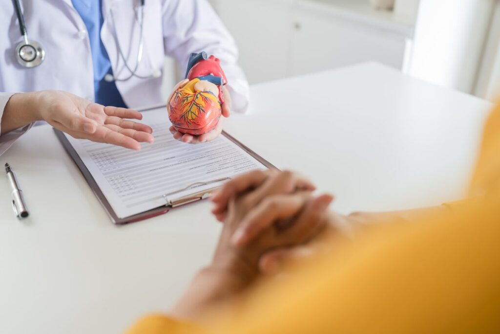 Cardiologist reviewing heart rhythm results with a patient during a consultation